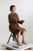    Aera  1 brown dots dress casual dressed sitting white oxford shoes whole body 0014.jpg
